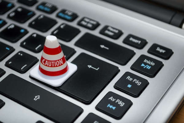 caution cone on a laptop